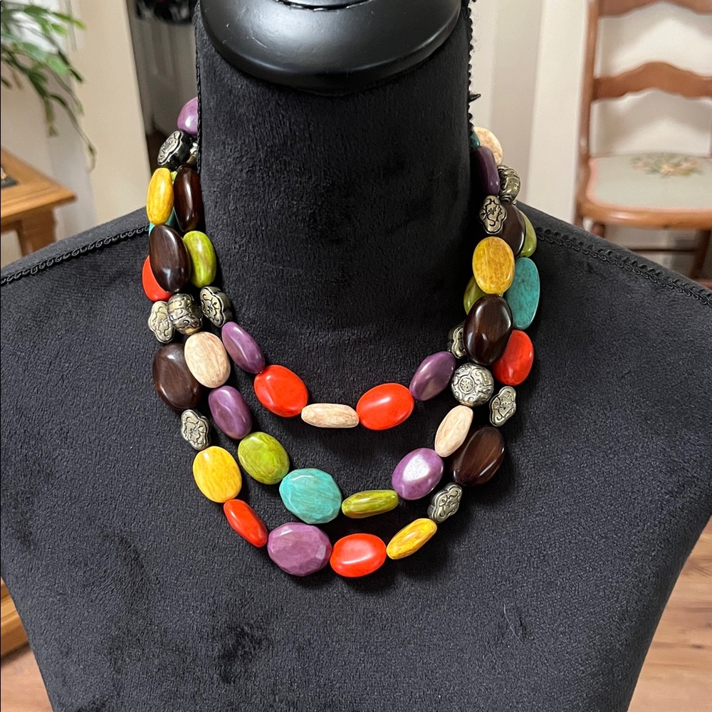 Colorful multi strand necklace with wooden beads and etched metal spacers